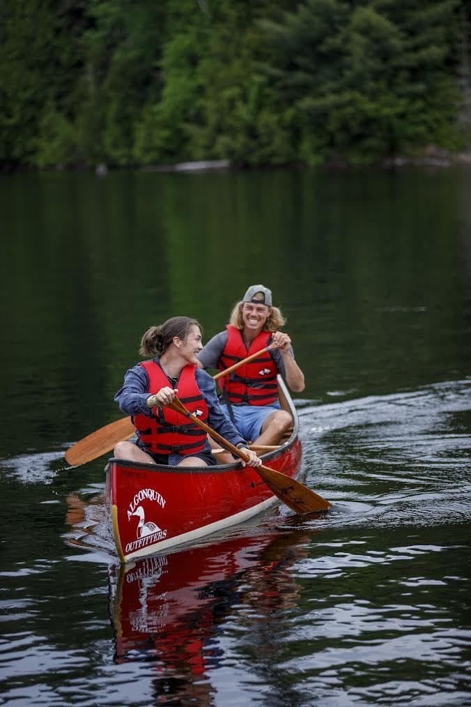 Paddlers setting off in a canoe