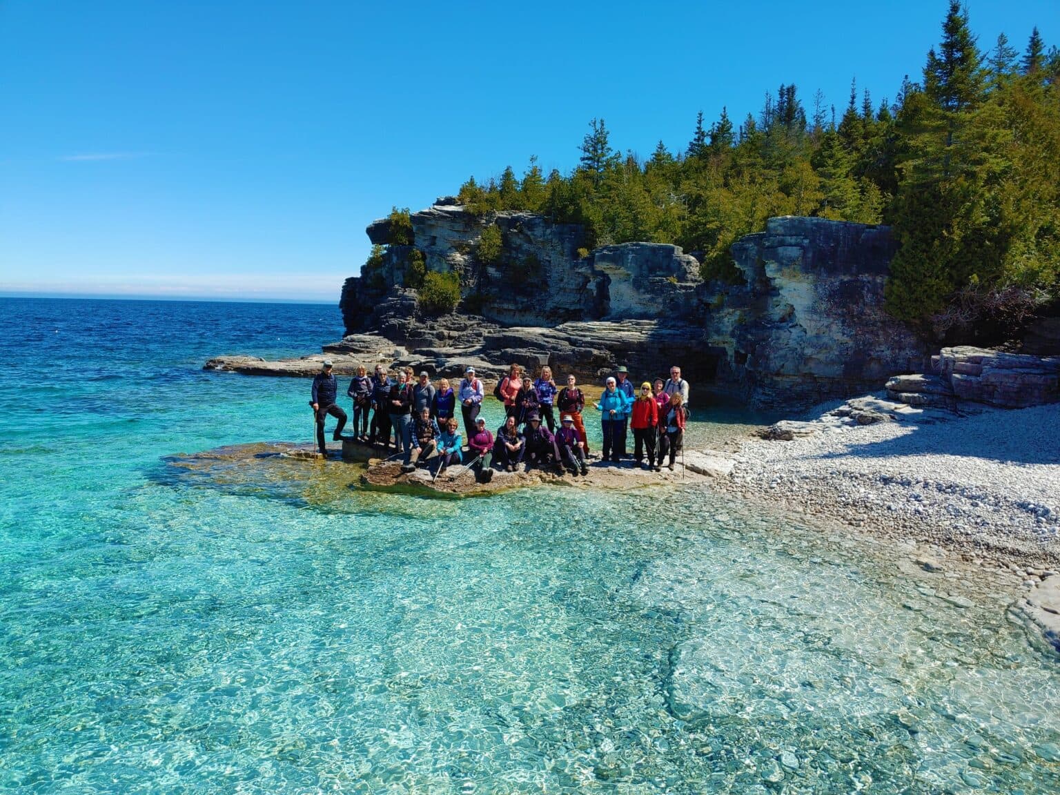 A Parkbus group on the white boulder shore at Indian Head Cove