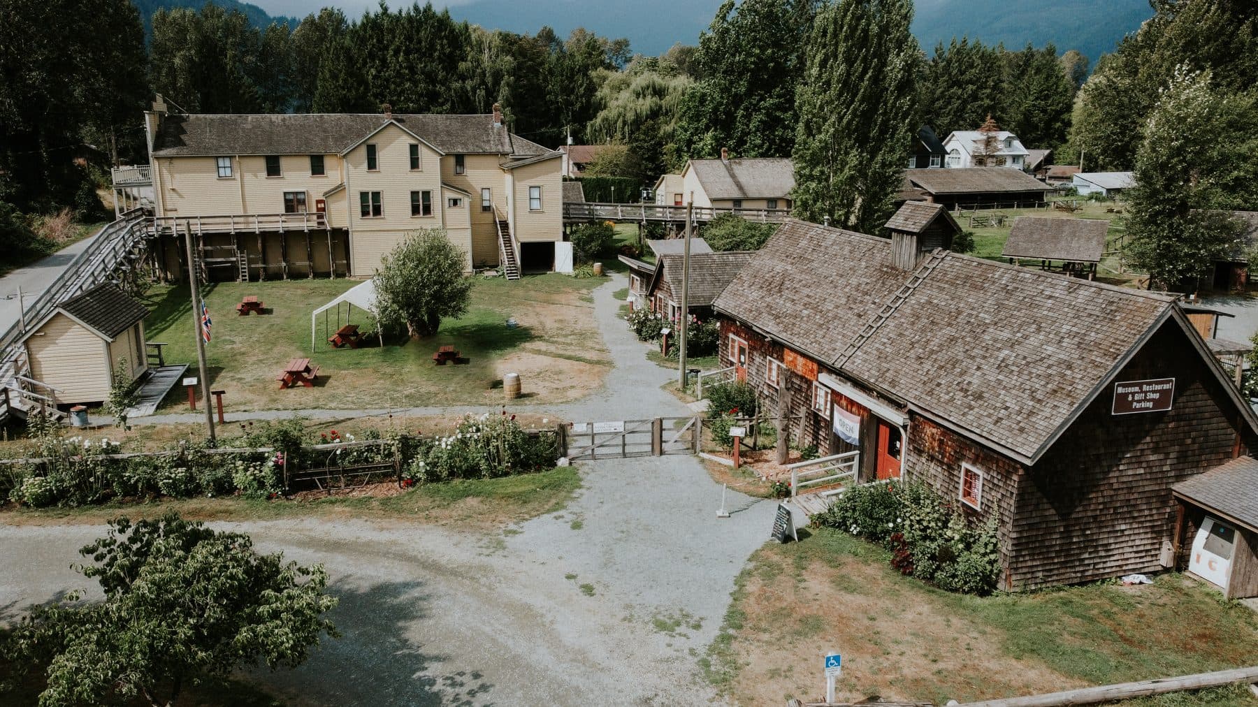 The farm buildings of Kilby Historic Site from the air, beside the river