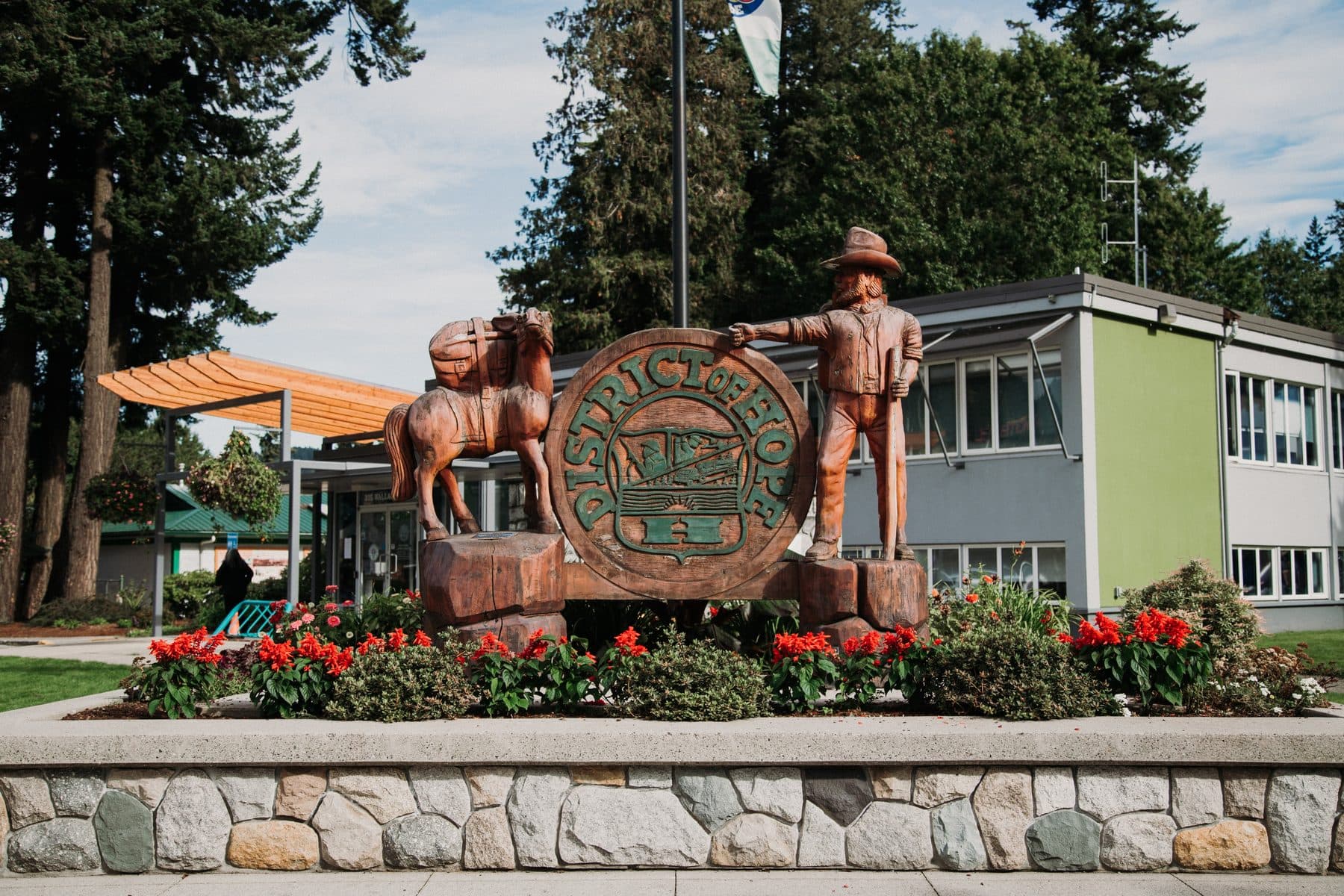 Downtown Hope, BC with chainsaw carvings and flowers
