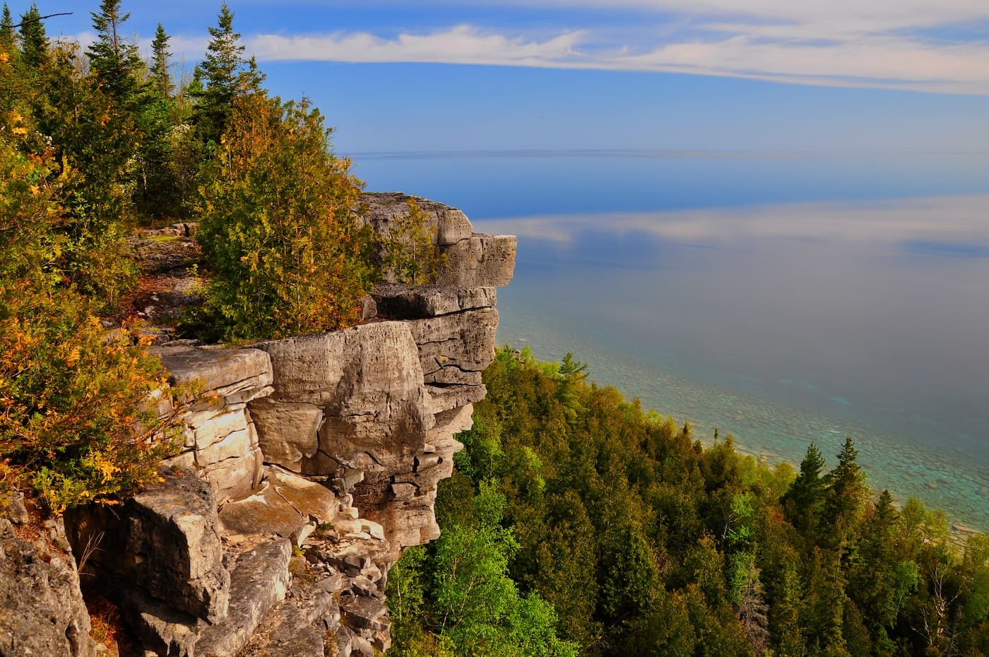 The Lion's Head lookout, a cliff jutting out over Georgian Bay in autumn colour