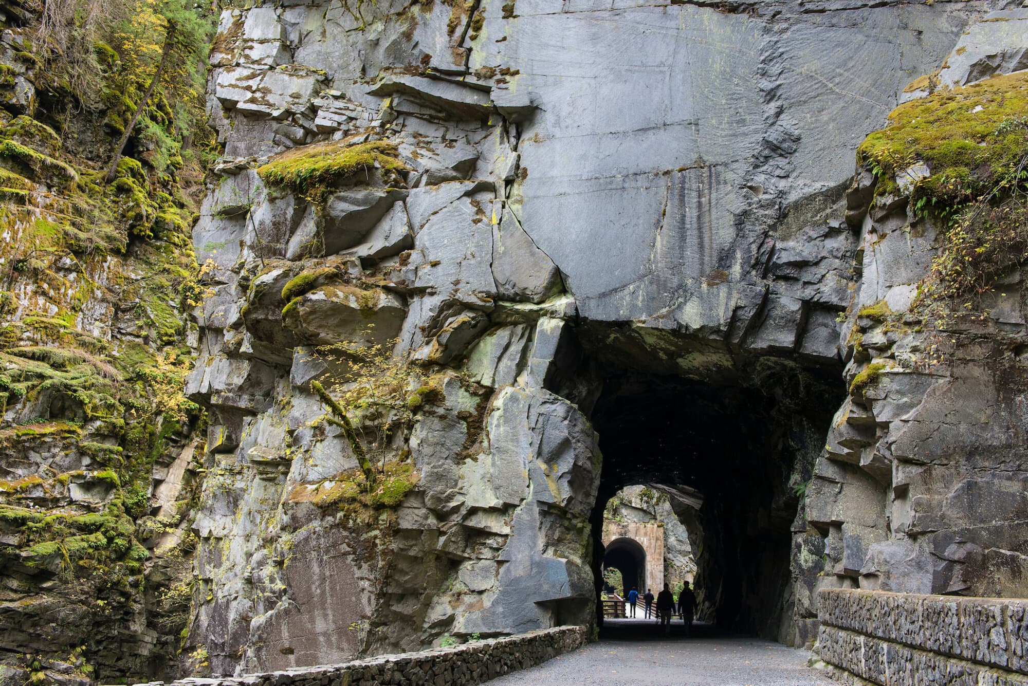 Walkers heading into one of the Othello tunnels through blasted granite