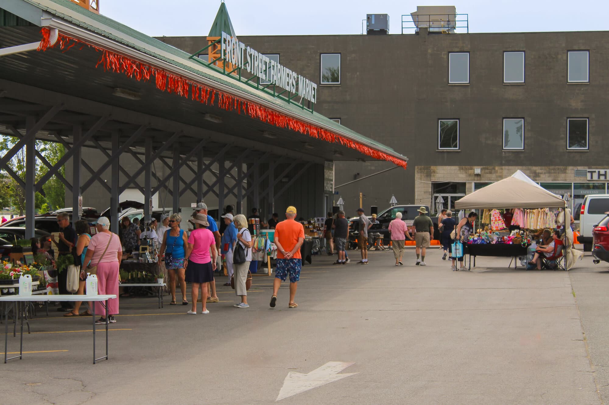 Shoppers under the pavilion at the Front Street Farmers' Market in Trenton