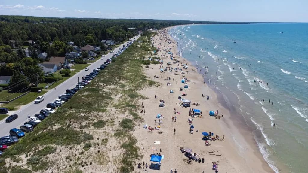 The long sand beach at Sauble Beach with Lake Huron beyond