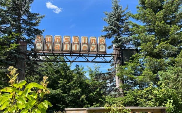The Sunshine Valley sign and mountain village