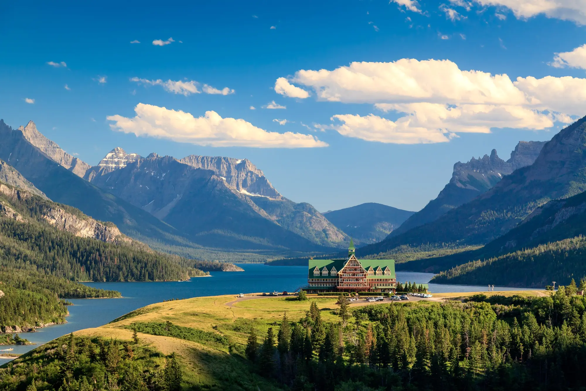 Upper Waterton Lake with the Prince of Wales Hotel on the bluff and the mountains behind