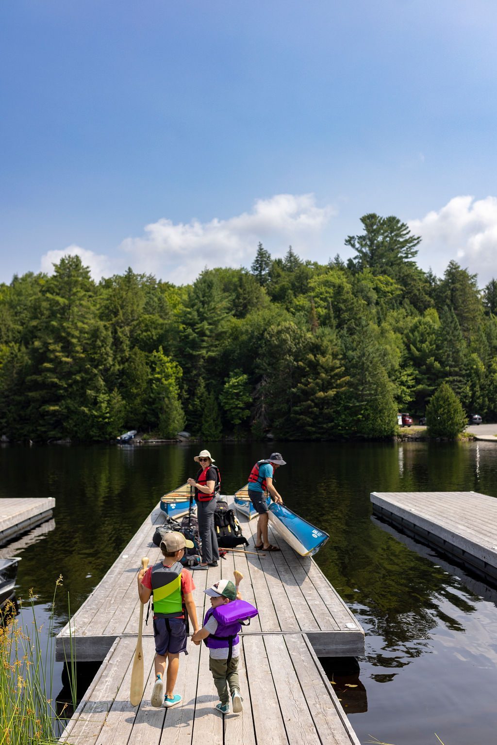 Carrying a canoe down the dock to the water